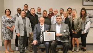 Ducommun leadership team and gold certification award